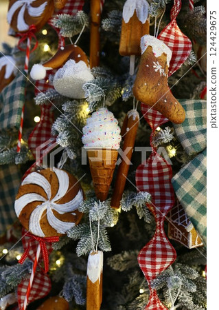 Enjoy charming and colorful festive holiday tree decorations filled with delightful sweet treats Enjoy charming and colorful festive holiday tree decorations filled with delightful sweet treats 124429675