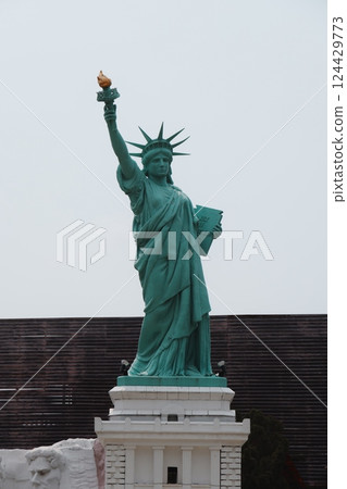 The iconic and magnificent Statue of Liberty located in New York City stands tall and proud 124429773