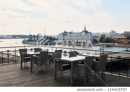 Delightful and charming dining space on the waterfront featuring a stunning cityscape view 124429797