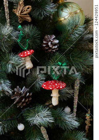 A Charming Holiday Tree adorned with beautiful, festive mushroom decorations that sparkle A Charming Holiday Tree adorned with beautiful, festive mushroom decorations that sparkle 124429951