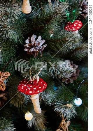 This festive Christmas Tree features Red Mushrooms and Pinecones, enhancing your holiday decor 124430023