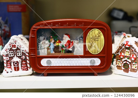 Charming Vintage Christmas Radio featuring a delightful scene with Santa and a Snowman figurine Charming Vintage Christmas Radio featuring a delightful scene with Santa and a Snowman figurine 124430096