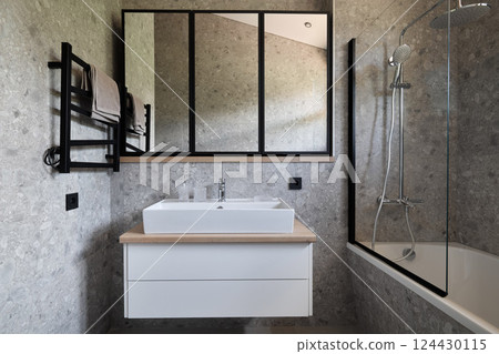 A modern bathroom with stylish fixtures and minimalist design showcasing elegance and simplicity 124430115