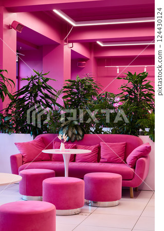 Experience the Pink Lounge with Modern Decor and lush Greenery for a delightful ambiance 124430124