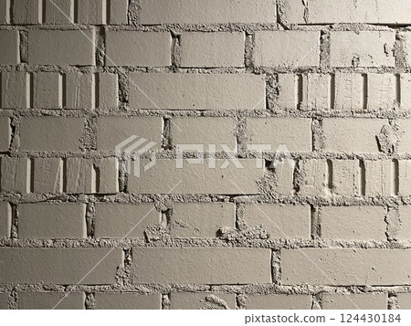 A beautifully textured grey brick wall background that adds depth and character to various designs A beautifully textured grey brick wall background that adds depth and character to various designs 124430184