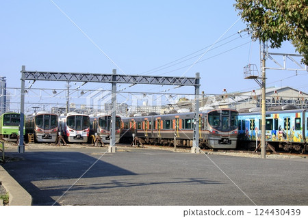 Osaka Loop Line trains parked at Morinomiya Train Depot 124430439