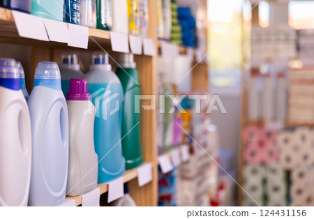 Shelf lined up with liquid detergent, household department assortment. Shelf lined up with liquid detergent, household department assortment. 124431156
