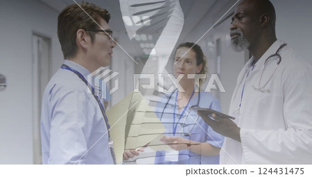 DNA strand image over medical professionals discussing in hospital corridor DNA strand image over medical professionals discussing in hospital corridor 124431475