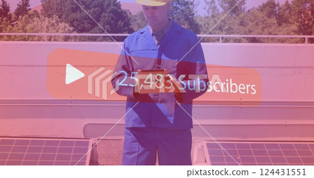 Construction worker holding tablet over subscriber count image 124431551