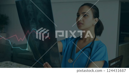 Analyzing X-ray, healthcare professional with stethoscope, heart rate image over image 124431687