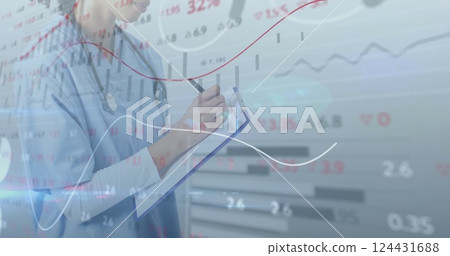Medical professional writing on clipboard over financial data and stock market image 124431688