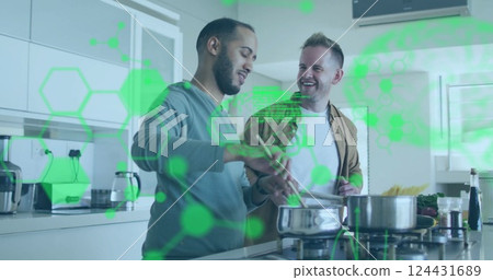 Cooking together in kitchen, green data processing image over couple 124431689