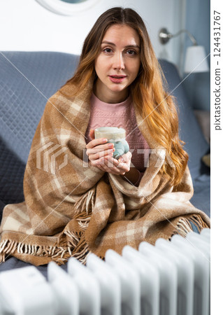 Woman feeling cold at home in winter 124431767