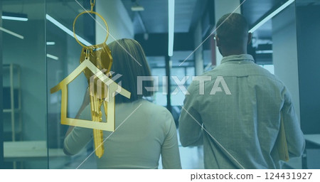 Image of gold house key and key fob over diverse businesspeople 124431927