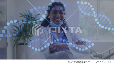 Image of dna strands over biracial female doctor with face mask Image of dna strands over biracial female doctor with face mask 124432047