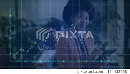 Image of financial data processing over african american businesswoman using tablet in office 124432068