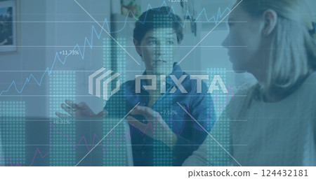 Financial data charts image over diverse business people discussing in office 124432181