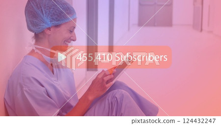 Medical professional using tablet over image showing 121,097 subscribers Medical professional using tablet over image showing 121,097 subscribers 124432247