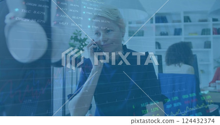 Financial data and stock market image over businesswoman talking on phone in office Financial data and stock market image over businesswoman talking on phone in office 124432374