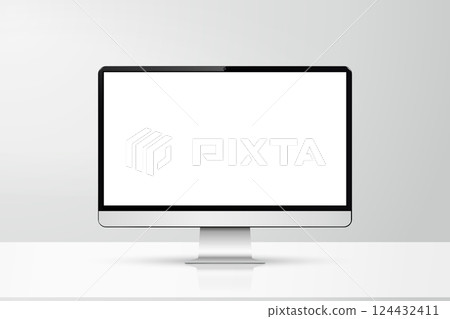 Front view of a computer with a white screen mockup on a table against grey wall in office 124432411