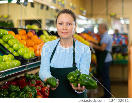 female seller selling peppers 124432681