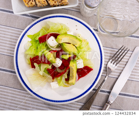 Salad of fresh vegetables with pim cheese, avocado and onion served on platter Salad of fresh vegetables with pim cheese, avocado and onion served on platter 124432834