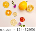 Slices of dried citrus fruits beautifully arranged on a table 124432950