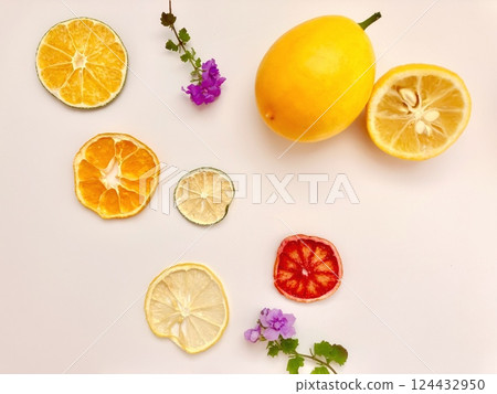 Slices of dried citrus fruits beautifully arranged on a table Slices of dried citrus fruits beautifully arranged on a table 124432950