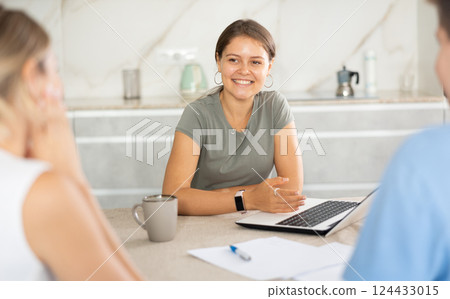 Girl agent agent offers good conditions for insurance or financial loan for spouses in home 124433015