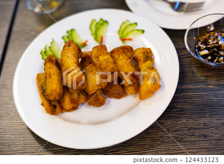 Fried eel in breadcrumbs and cucumbers. Chinese Cuisine Fried eel in breadcrumbs and cucumbers. Chinese Cuisine 124433123