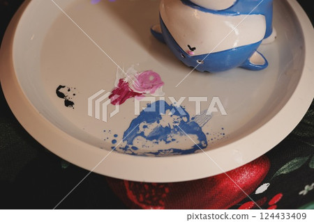 Whimsical Art Displayed on a Beautiful Plate Made with Colorful and Unique Ceramics 124433409