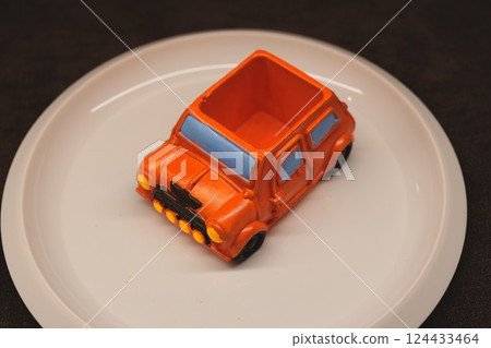 A Bright and Colorful Toy Car Laid Out in an Impressive Plate Setting Ready for Display A Bright and Colorful Toy Car Laid Out in an Impressive Plate Setting Ready for Display 124433464
