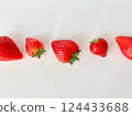 Cute strawberries arranged on a table 124433688