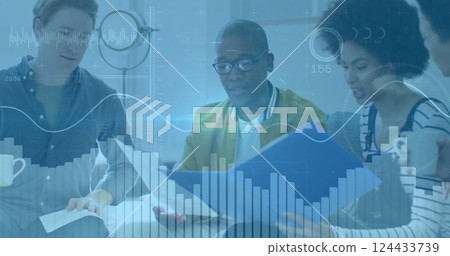 Image of financial data processing over diverse colleagues discussing work in office 124433739