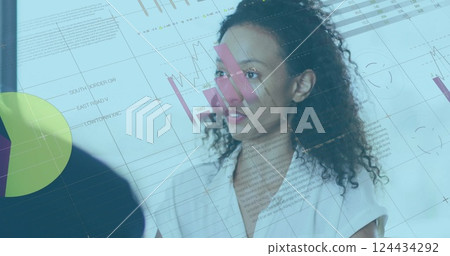 Image of financial data processing over biracial businesswoman in office Image of financial data processing over biracial businesswoman in office 124434292