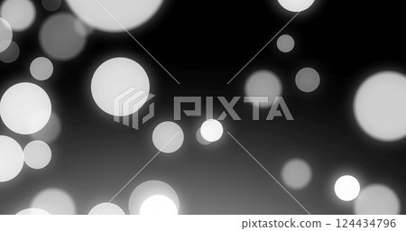 Image of moving white spots on black background Image of moving white spots on black background 124434796