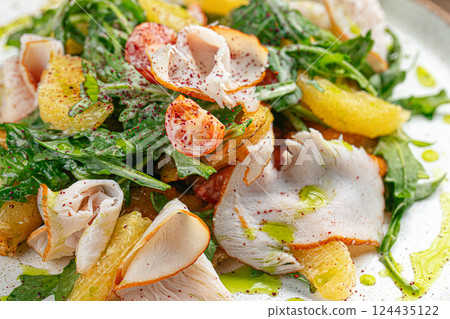 Smoked turkey salad with arugula and oranges 124435122