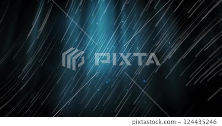 Image of glowing light trails over dark background 124435246