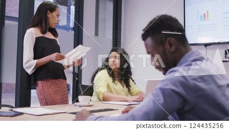 Image of financial data processing over diverse business people in office Image of financial data processing over diverse business people in office 124435256