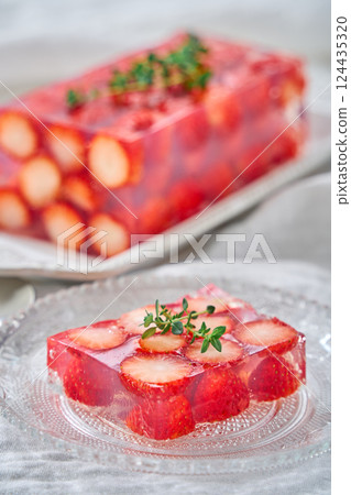 A transparent strawberry terrine with beautifully arranged strawberries 124435320