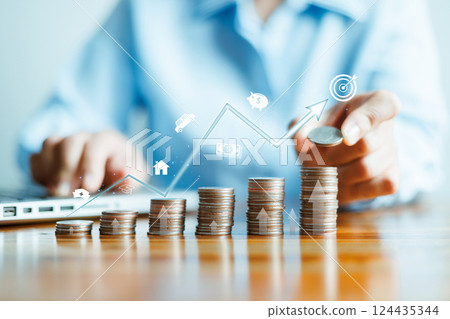 Businesswoman putting money in stack coins and goal and achievement chart graph and arrows. Funds loans and Investment profits. Concept of saving for insurance, health, education, house, car, tax 124435344