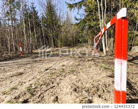 An open barrier in the forest in spring. Open barrier in the forest An open barrier in the forest in spring. Open barrier in the forest 124435372