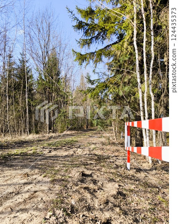 An open barrier in the forest in spring. Open barrier in the forest An open barrier in the forest in spring. Open barrier in the forest 124435373