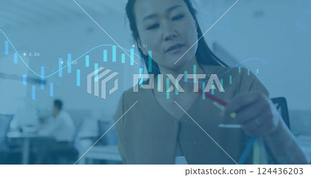 Image of financial data processing over biracial businesswoman in office Image of financial data processing over biracial businesswoman in office 124436203