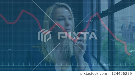 Image of financial data processing over caucasian businesswoman looking through window in office 124436259