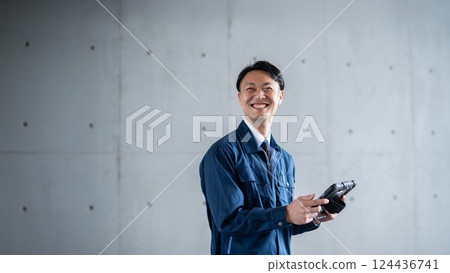 A man with a tablet A man with a tablet 124436741