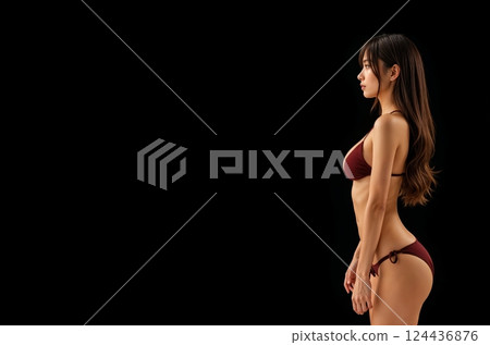 Body lines stand out against a black background [Generative AI] 124436876