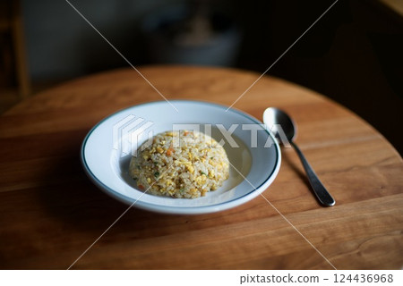 Simple fried rice served in a round shape on a plate 124436968