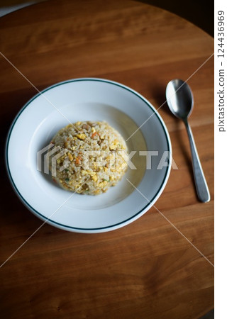 Simple fried rice served in a round shape on a plate 124436969