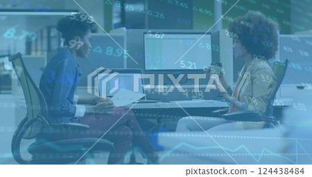 Image of financial data processing over diverse business people in office Image of financial data processing over diverse business people in office 124438484